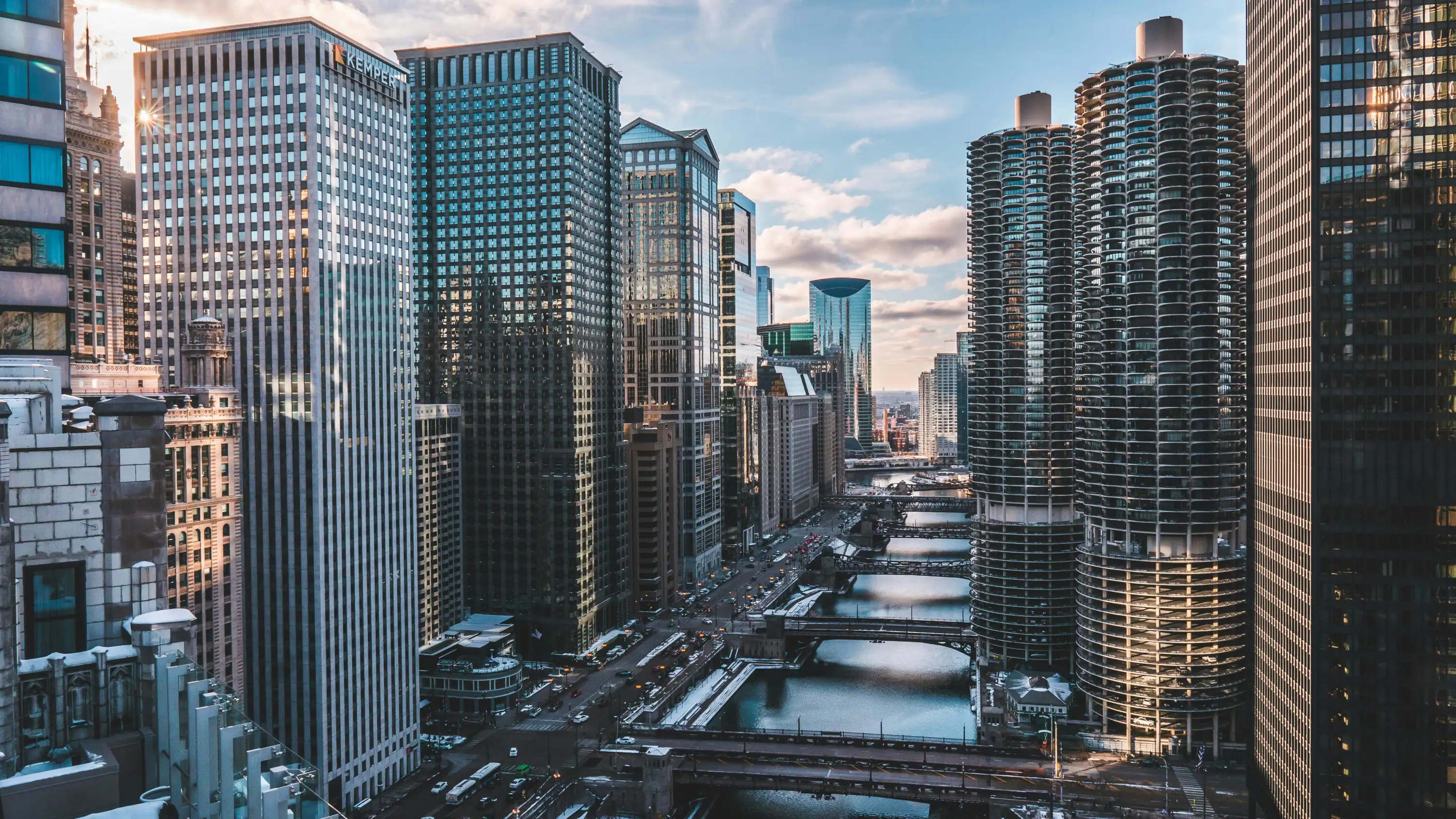 A picture of the Chicago river flanked by skyscrapers