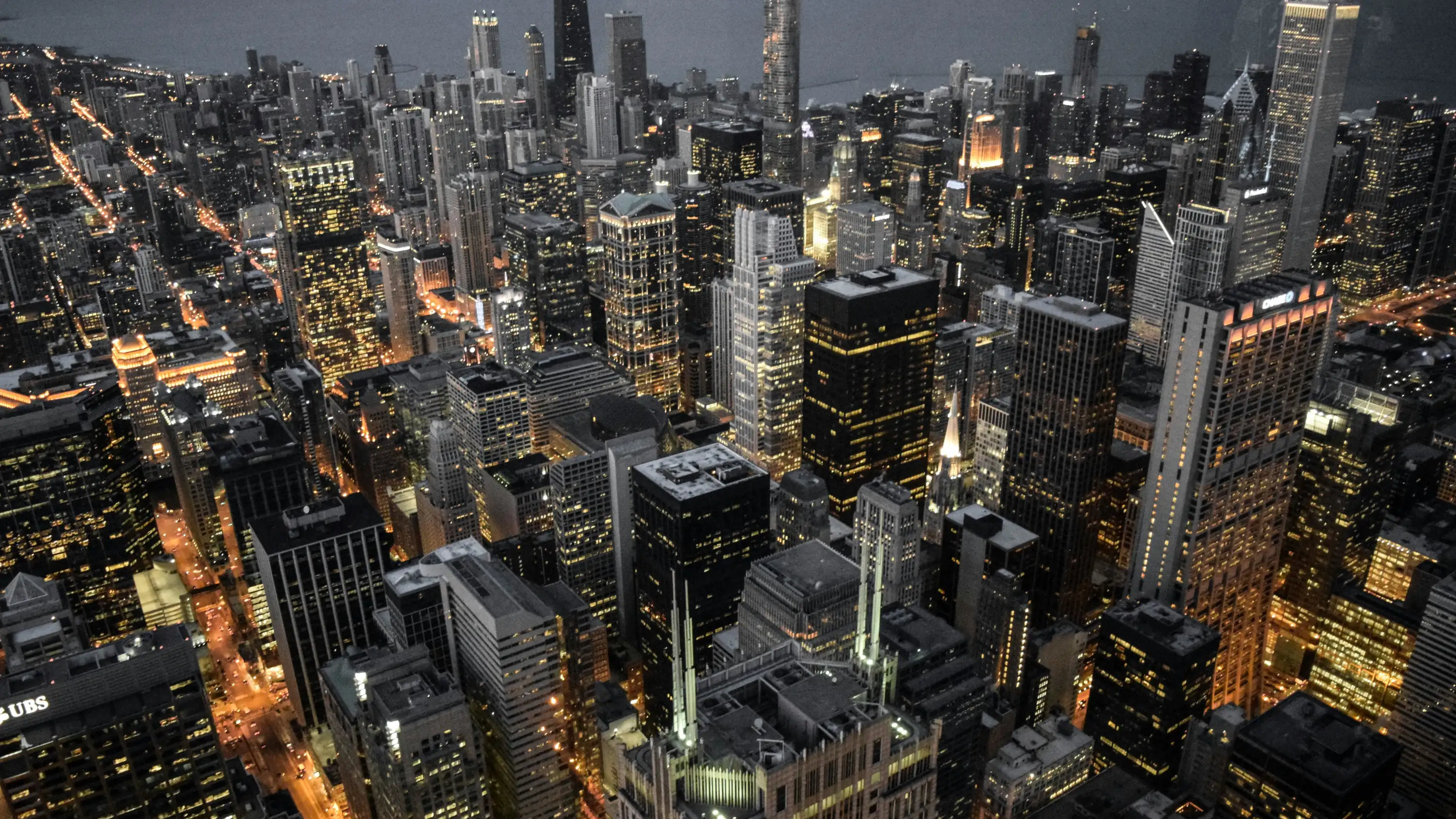 A picture of the Chicago river flanked by skyscrapers